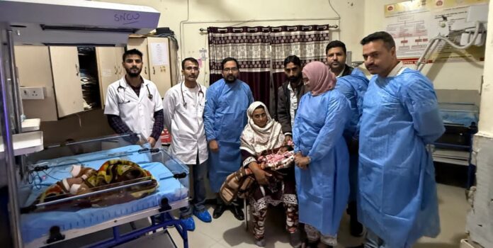 GMC Doda NICU staff with newborn and care equipment