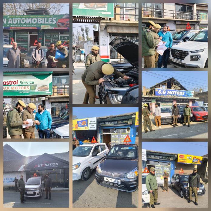 Awantipora Police officers conducting vehicle inspections