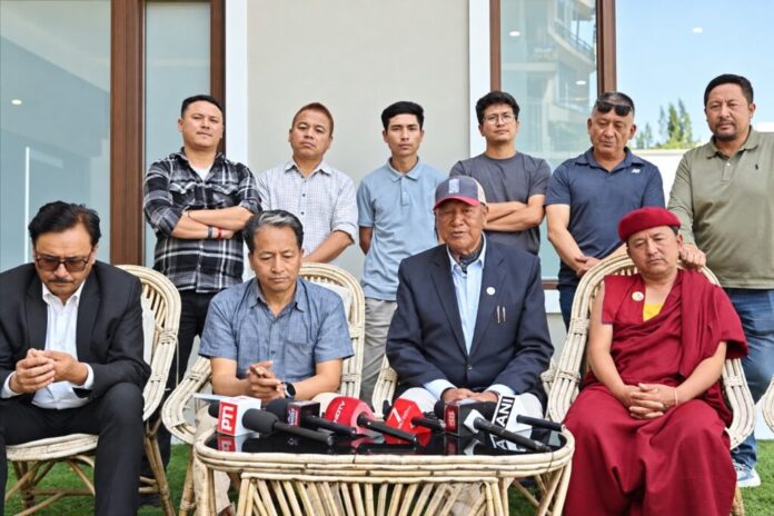 LAB Chair Chering Dorje Lakruk speaks during protest